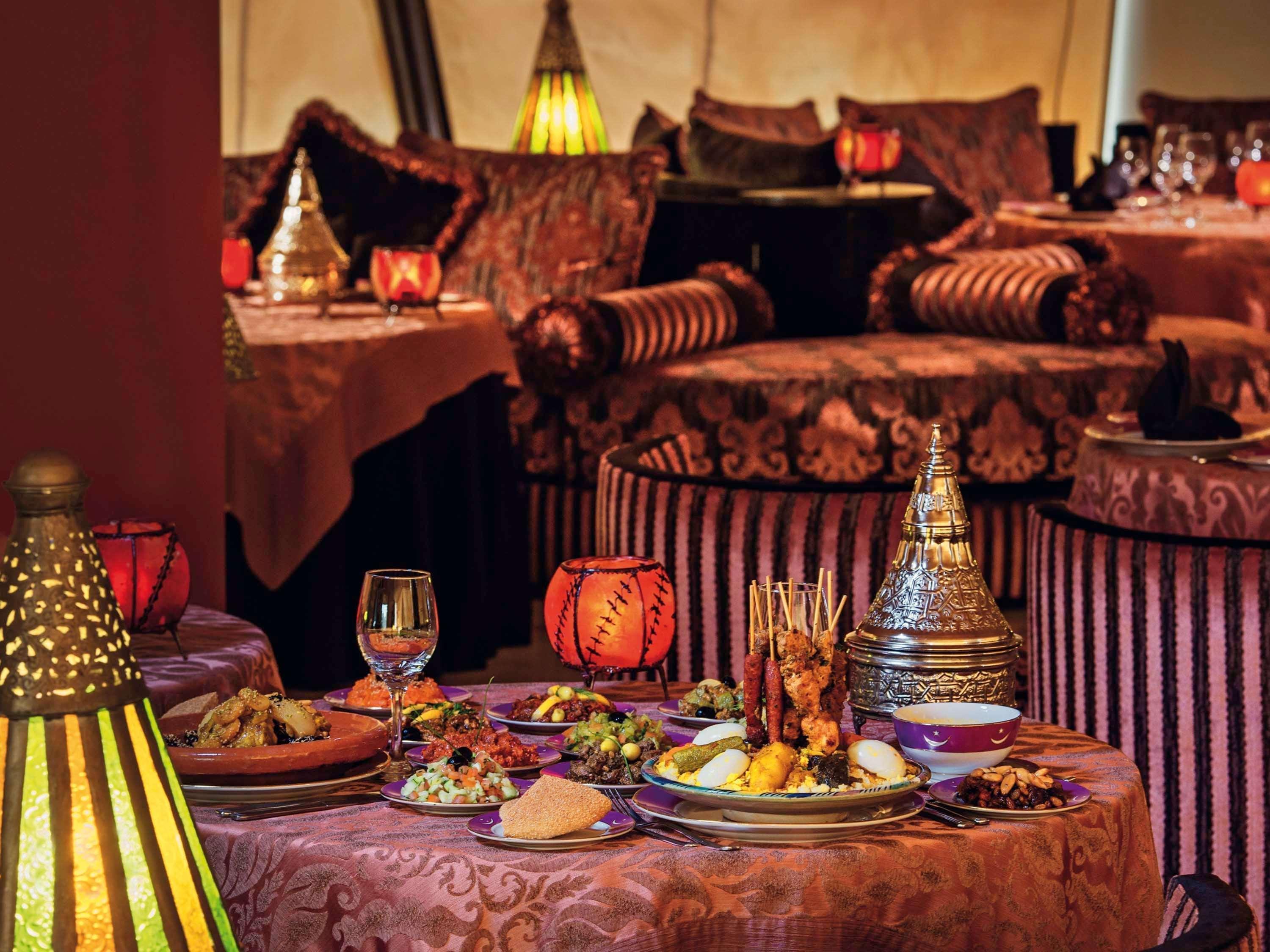 Moevenpick Hotel & Casino Malabata Tanger Kültér fotó A table at Al Dar
